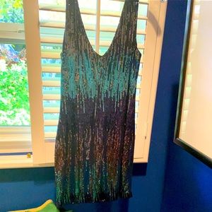 Shine in this sequined mini